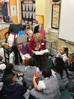 Carole leads a discussion with a class of 3rd grade girls on what they like about themselves that makes them different, based on the message in Dr. Seuss' The Sneetches.